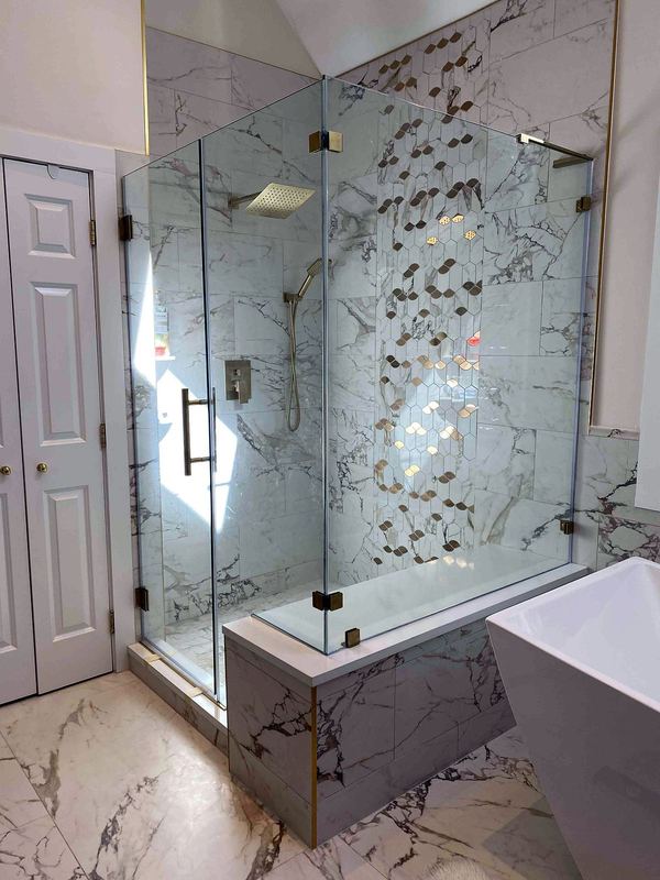 Corner frameless glass shower enclosure with hinged door by Shower Enclosures by George